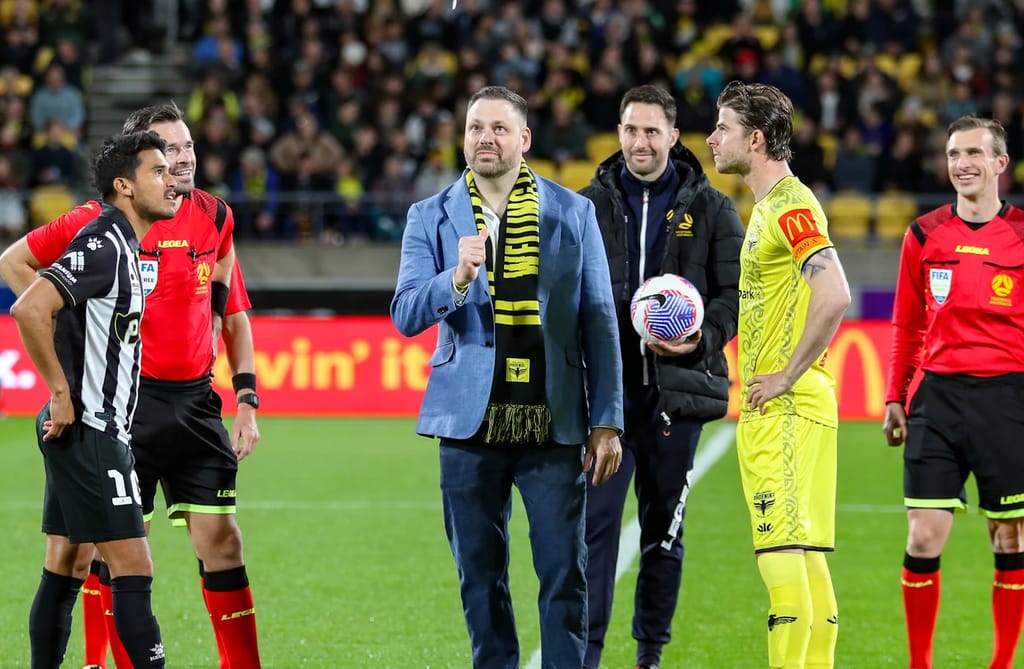 Hayden Kirk doing the coin flip for Wellington Phoenix